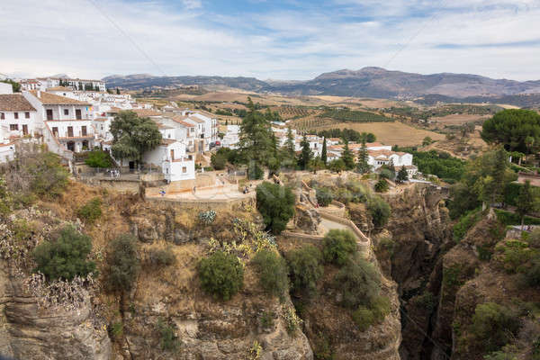 View down the steep rockface to valley in Ronda Stock photo © backyardproductions