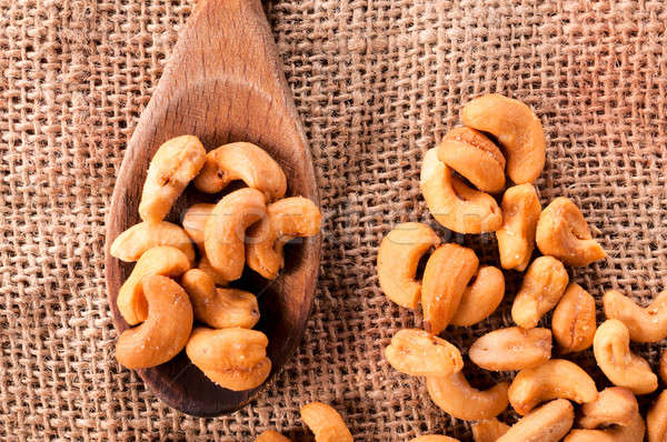 Cashew nuts and spoon Stock photo © badmanproduction