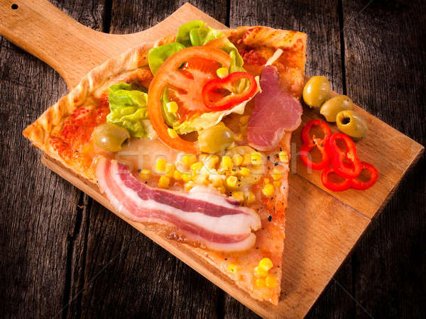 Slice of pizza Stock photo © badmanproduction