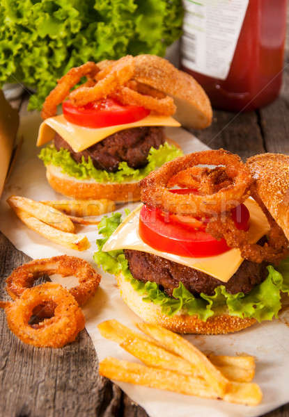 Burger and onion rings Stock photo © badmanproduction