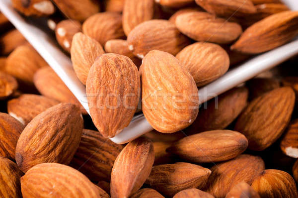 Raw almonds Stock photo © badmanproduction