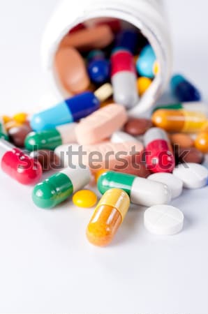 Pills on white background Stock photo © badmanproduction