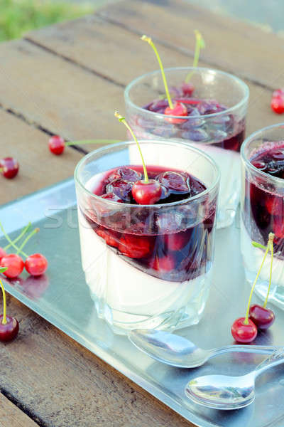Panna cotta and cherries jelly Stock photo © badmanproduction