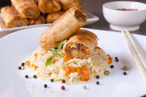 Spring rolls and rice Stock photo © badmanproduction