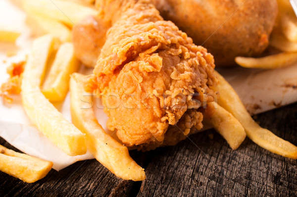 Sültcsirke hús közelkép mély sültkrumpli étel Stock fotó © badmanproduction