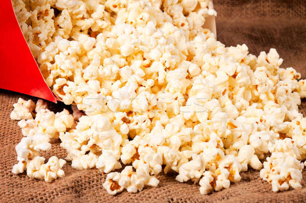 Splashed pop corn Stock photo © badmanproduction