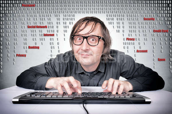 Hacker in action Stock photo © badmanproduction
