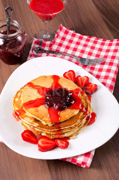 Strawberries jam and homemade pancakes Stock photo © badmanproduction