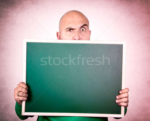 Podejrzliwy człowiek łysy kredy pokładzie Zdjęcia stock © badmanproduction