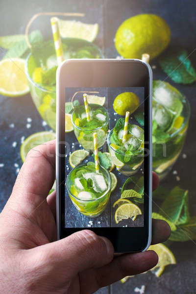 Adam soğuk mojito cep telefonu gıda Stok fotoğraf © badmanproduction