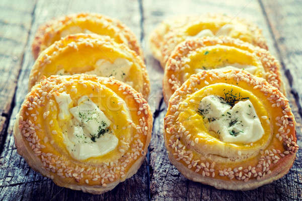 Golden pastry with cheese Stock photo © badmanproduction