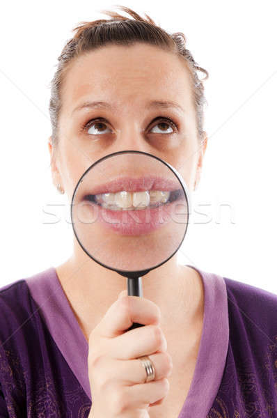 Tooth on magnifying Stock photo © badmanproduction