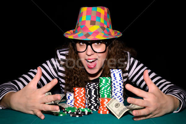 Happy poker face Stock photo © badmanproduction
