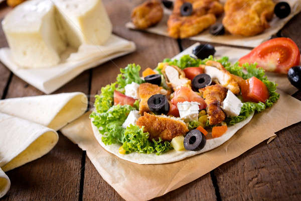 Chicken salad on tortilla Stock photo © badmanproduction