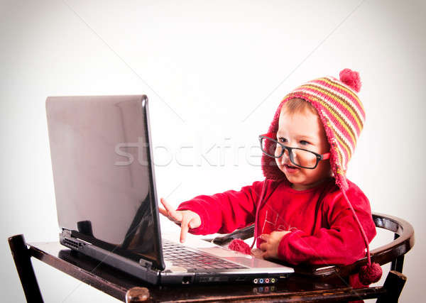 Baby typing on keyboard Stock photo © badmanproduction