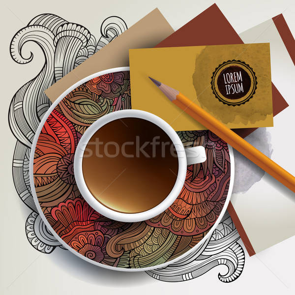 Cup of coffee, business cards and ornaments Stock photo © balabolka