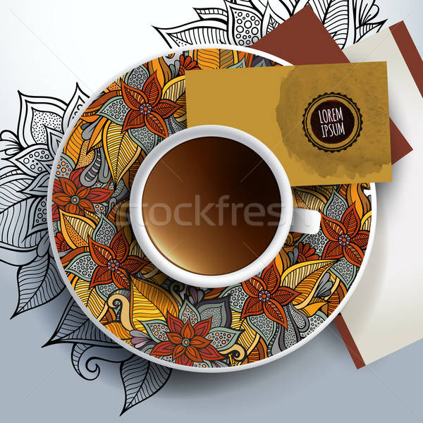Cup of coffee, business cards and ornaments Stock photo © balabolka