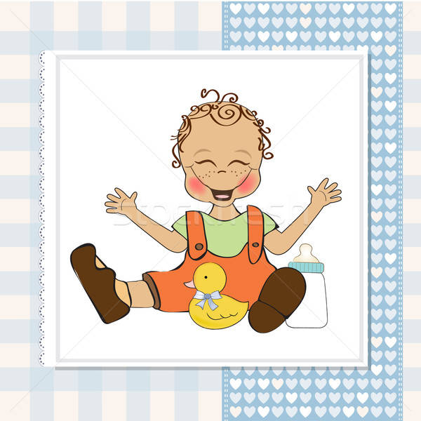 baby boy playing with his duck toy, welcome baby card Stock photo © balasoiu