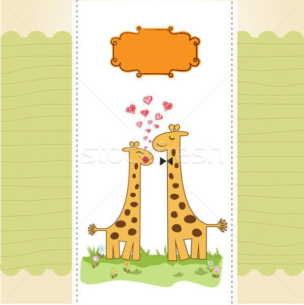 Funny giraffe couple in love Stock photo © balasoiu