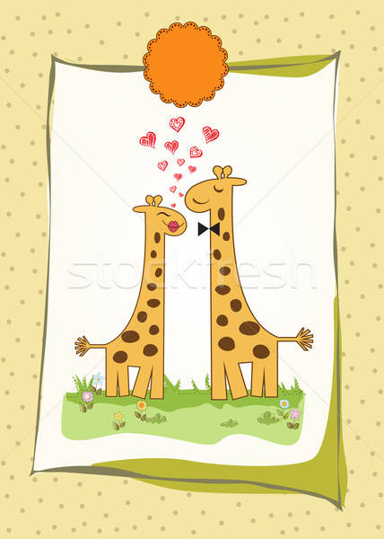 Funny giraffe couple in love Stock photo © balasoiu