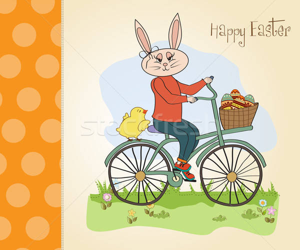 Easter bunny with a basket of Easter eggs Stock photo © balasoiu