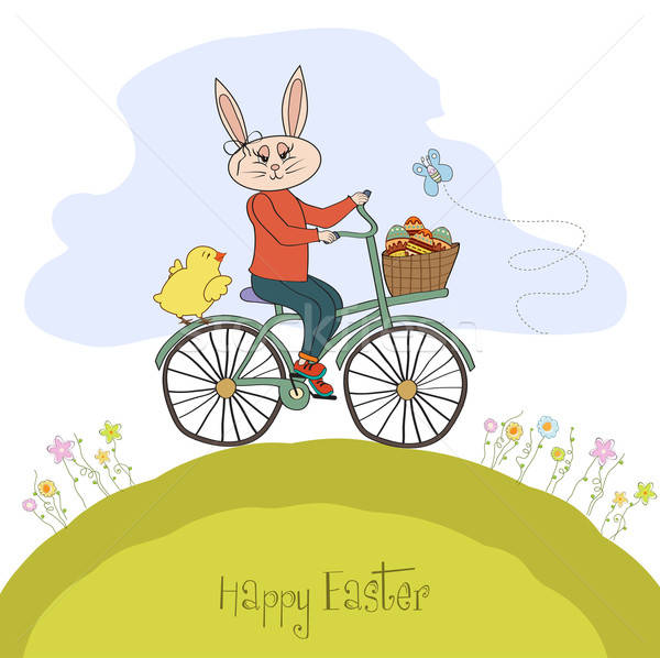 Easter bunny with a basket of Easter eggs Stock photo © balasoiu