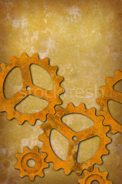 Rusty gears against a mottled yellowish background Stock photo © Balefire9