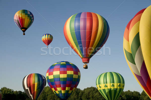 Hot-air balloons ascending or launching at a ballooning festival Stock photo © Balefire9