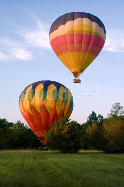 Two hot-air balloons taking off or landing Stock photo © Balefire9