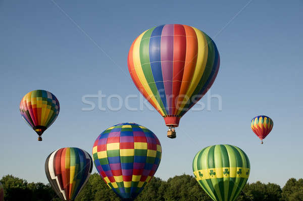 Hot-air balloons ascending or launching at a ballooning festival Stock photo © Balefire9