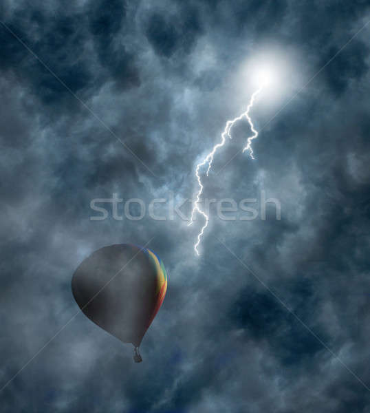 Hot-Air Balloon Among Dark Storm Clouds with Lightning Stock photo © Balefire9