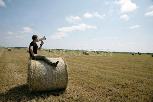 Stock photo: man on bale with loudspeaker