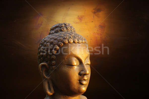 Stock photo: Head of Budha on golden background