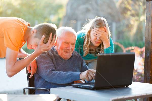 Désespéré grand-père pas femme sourire portable [[stock_photo]] © barabasa