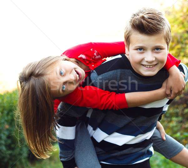 Playing with my little sister Stock photo © barabasa