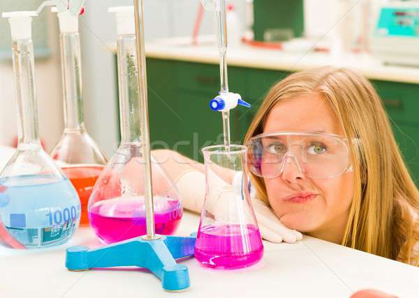 Frustrated young student on chemistry Stock photo © barabasa