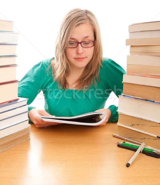 Young beautiful student studying attentively for her finals. Stock photo © barabasa