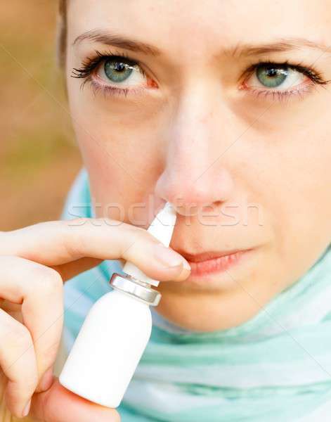 Snuffing nasal spray Stock photo © barabasa