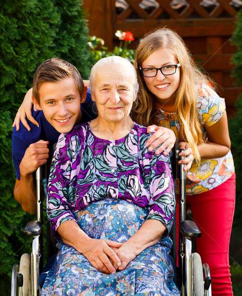 Babcia nastolatek wnuki starych niepełnosprawnych rodziny Zdjęcia stock © barabasa