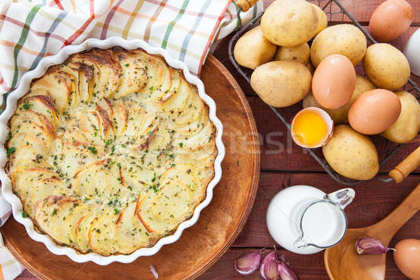 Potato gratin in round baking dish Stock photo © BarbaraNeveu