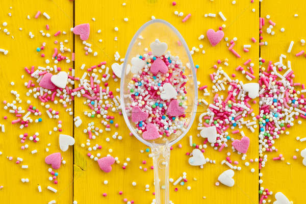 Colorful sprinkles on yellow Stock photo © BarbaraNeveu