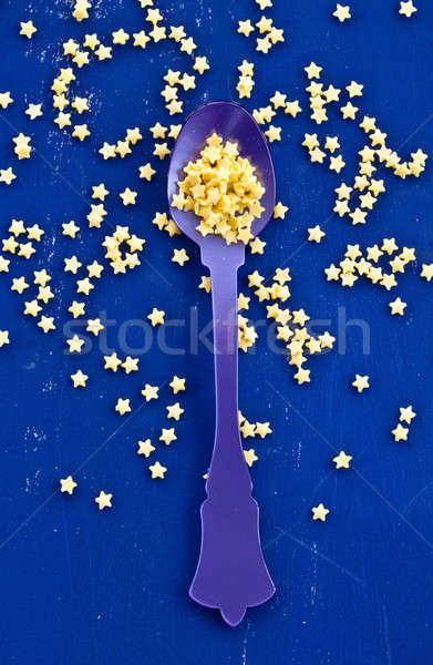 Yellow sugar stars on blue Stock photo © BarbaraNeveu
