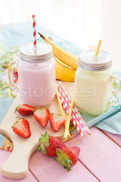 Milk with fresh strawberries and bananas Stock photo © BarbaraNeveu