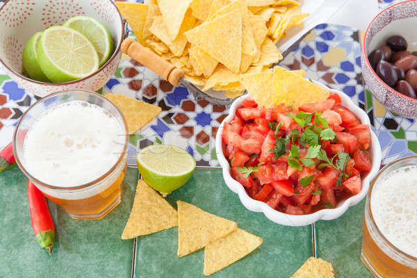 Stock photo: Tortilla Chips with tomato salsa