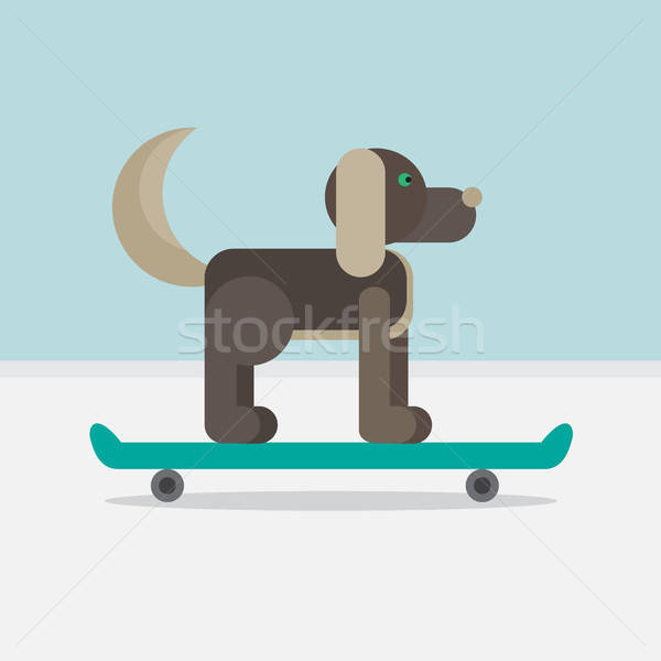 Dog sitting on a skateboard Stock photo © barsrsind