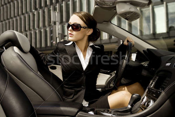 Femme d'affaires conduite voiture belle brunette argent Photo stock © bartekwardziak