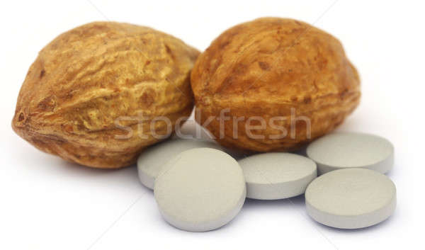 Medicinal Haritaki fruits with tablets Stock photo © bdspn