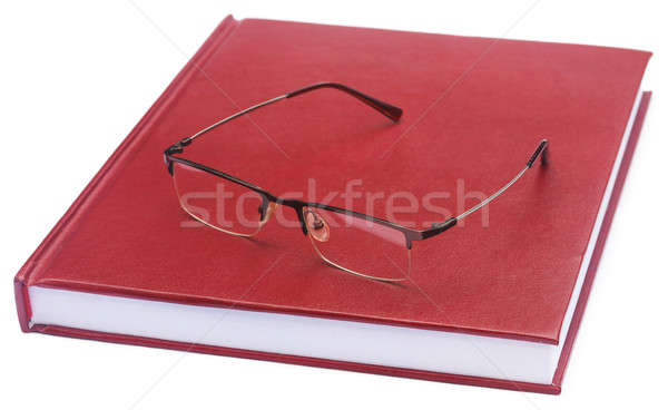 Maroon colored thesis paper with spectacles Stock photo © bdspn
