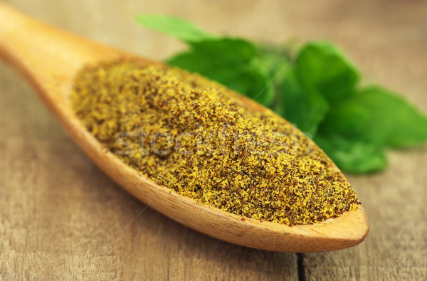 Grated mustard seeds with green herbs Stock photo © bdspn