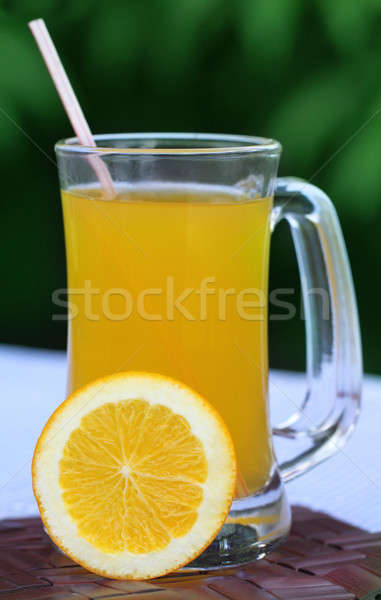 Orange juice with sliced orange Stock photo © bdspn